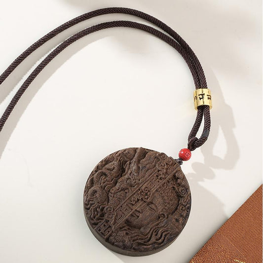 Tibetan Buddhist handmade agarwood sandalwood pendant with vermilion bead for spiritual mindfulness.