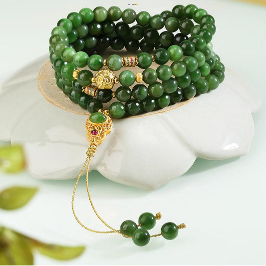 Handmade Tibetan Buddhist jade 108 bead mala necklace with 925 silver and cubic zirconia for peace and balance.