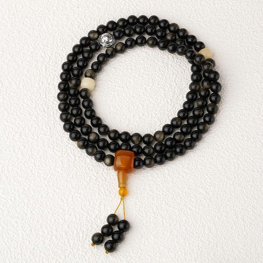 Handmade Tibetan Buddhist golden obsidian 108 mala with Bodhi and silver elephant charm.
