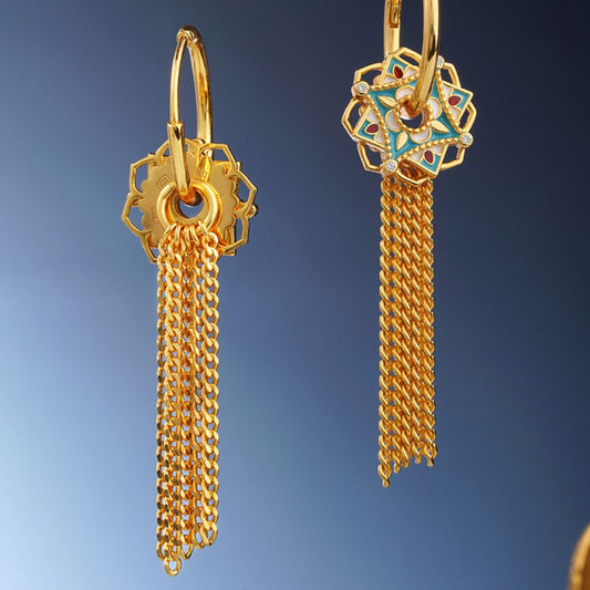 "Tibetan Buddhist-inspired 925 silver earrings with hollow lotus flower design and silver tassels, symbolizing the blossoming of spiritual enlightenment."