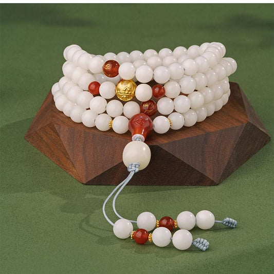 Handcrafted Tibetan Buddhist bodhi bead necklace with agate and 925 silver accents.