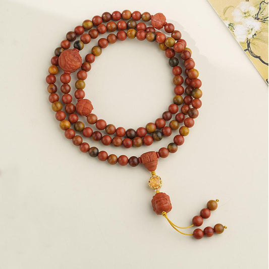 Handmade Tibetan Buddhist 108 beads bracelet made from polished BoShan red agate and 925 silver for spiritual energy and protection.