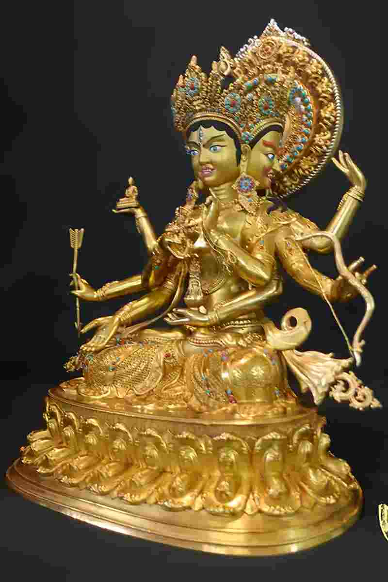 Hand-painted brass Ushnisha Vijaya Buddha statue, authentic Tibetan Buddhist art representing compassion and spiritual protection.