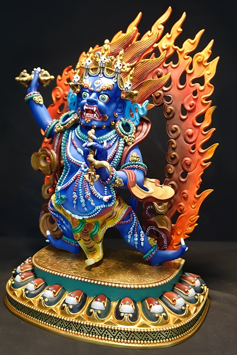 alt text: Hand-painted brass Vajrapani statue, a unique Tibetan Buddhist art piece showcasing vibrant Buddha statue artistry.
