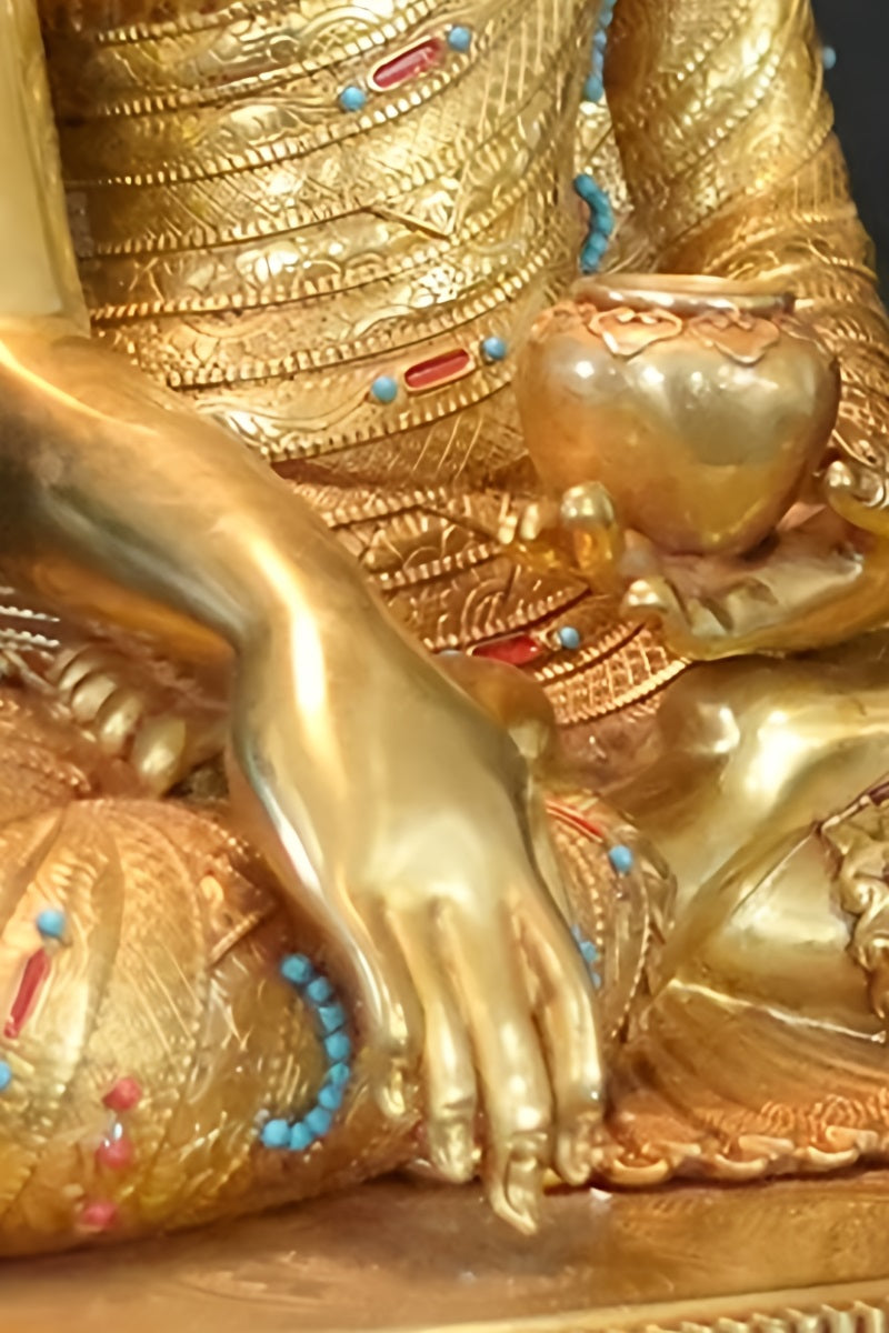 "Handcrafted Tibetan Buddhist Buddha statue with mineral painting, showcasing detailed craftsmanship."