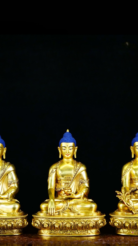 Alt Text: Handcrafted Tibetan Buddhist Three Buddhas statue with gilded gold and mineral pigments, a masterpiece of Buddhist art symbolizing wisdom and compassion.
