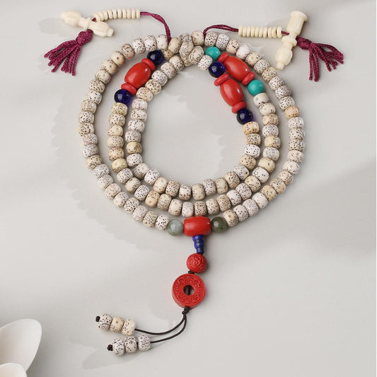 Handcrafted Tibetan Buddhist cinnabar and bodhi seed mala with lapis lazuli connector