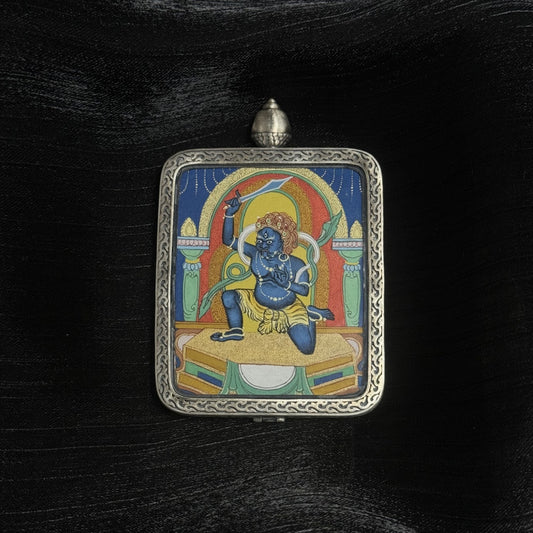 Close-up detail of the Chigung Acala Thangka painting showing intricate natural mineral pigment work and wrathful iconography, showcasing the artistry of Tibetan lineage painters.