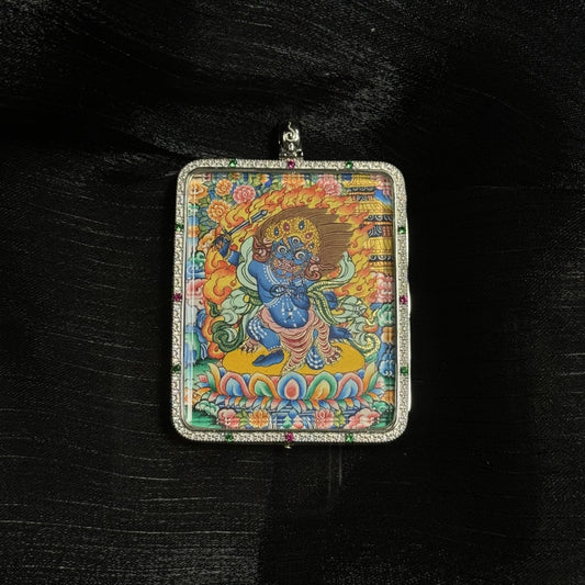 A 4x5cm hand-painted Acala with Eight Guardians and Mandala Thangka pendant featuring the Immovable Wisdom King, representing wisdom and protection in Tibetan Buddhist tradition.