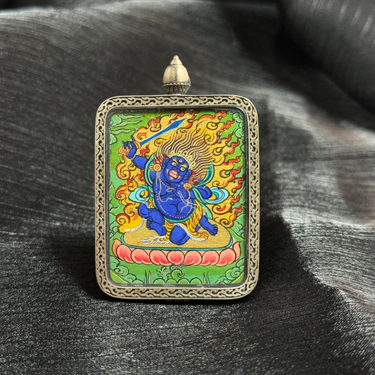 Detailed view of the presentation and casing for the Acala Cuiying Thangka pendant, symbolising protection and tradition in Buddhist practice.