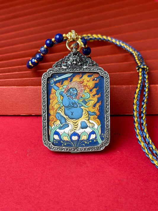 Close-up detail of the Tibet Acala Thangka showing hand-painted mineral pigments, gold and lapis, showcasing the masterful artistry.