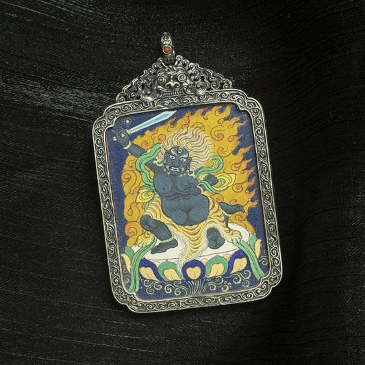 The Tibet Coarse Acala Thangka pendant displayed as a sacred amulet for protection and wisdom, embodying Tibetan Buddhist tradition.