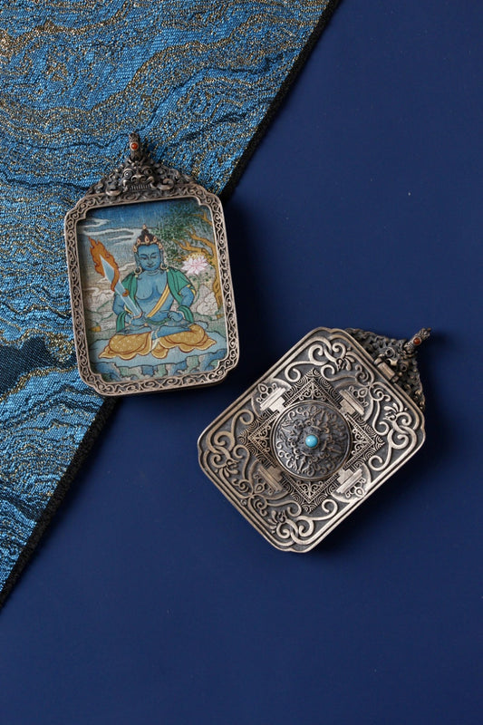 Tibetan Buddhist thangka pendant depicting Akasagarbha Bodhisattva, symbolizing boundless wisdom and spiritual abundance.