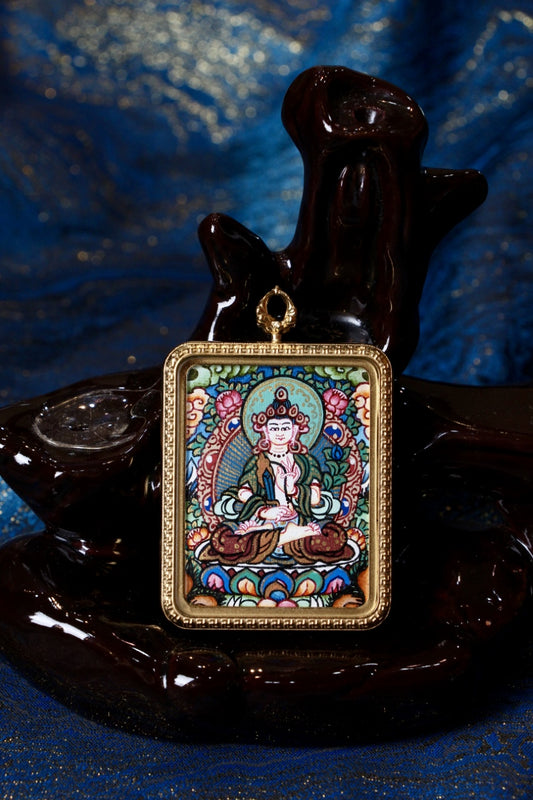 Akasagarbha thangka pendant representing infinite wisdom and spiritual abundance in Tibetan Buddhist culture.