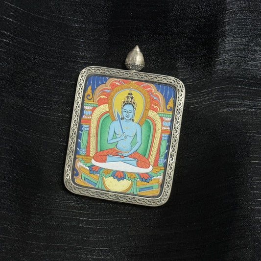 A 4x5cm hand-painted Karma Kagyu Akasagarbha Bodhisattva Thangka pendant featuring the Bodhisattva of the Treasury of Space, encased in 925 silver Dunhuang Nine-Colour Deer casing, representing wealth and merit in Tibetan Buddhist tradition.