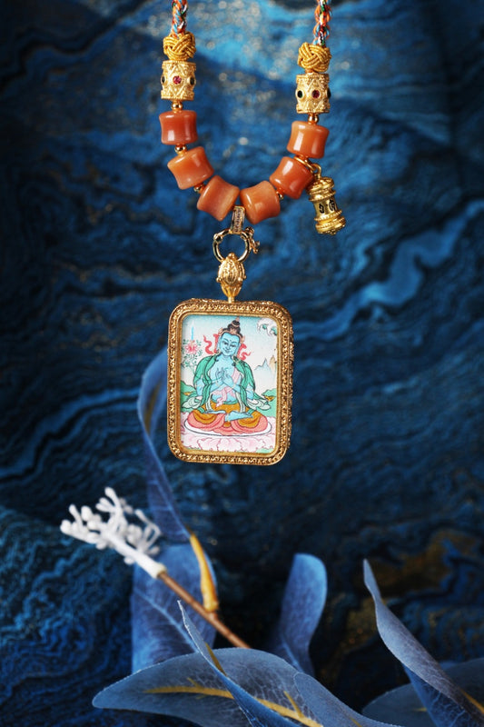 The Karma Kagyu Akasagarbha Thangka pendant displayed as a sacred amulet for wealth and prosperity, embodying the space treasury wisdom of Tibetan Buddhist tradition.