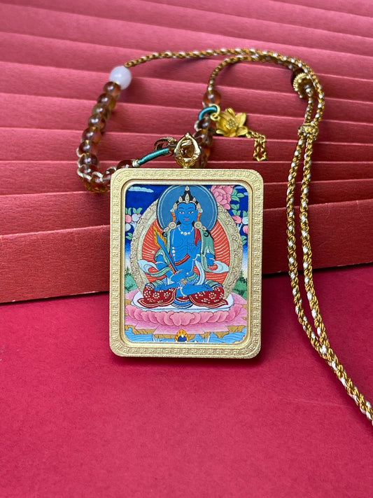 Hand-painted Rekong Akasagarbha (虚空藏菩萨) Thangka pendant 3.4x4.5cm with silver casing featuring wisdom as weapon and wealth as vast as the void, representing wisdom in Buddhist tradition.