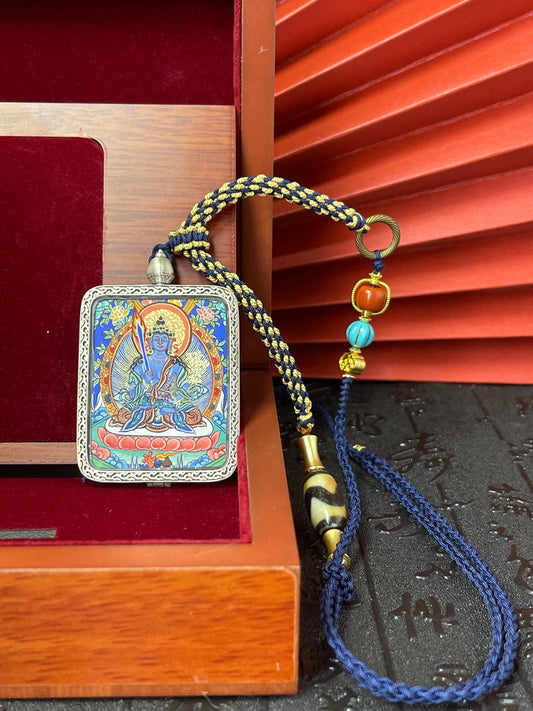 Hand-painted Rekong Akasagarbha (虚空藏菩萨) Thangka pendant 3.4x4.5cm with silver casing featuring wisdom as weapon and wealth as vast as the void, representing wisdom in Buddhist tradition.