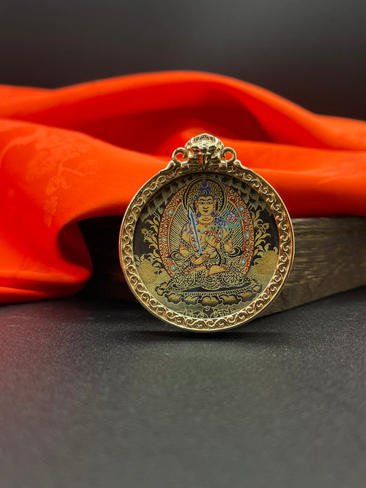 A 3.5cm hand-painted Rekong Black Gold Akasagarbha (虚空藏菩萨) Thangka pendant with copper casing featuring the wealth deity of the Buddhist realm, representing wealth and fortune in Buddhist tradition.