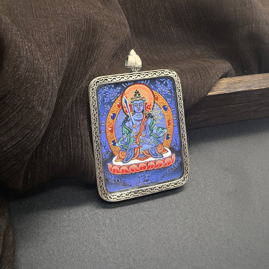 A 3.5x4.5cm hand-painted Rekong Blue Thangka Akasagarbha (虚空藏菩萨) Thangka pendant with 925 silver featuring the treasury deity of the Buddhist realm and fundamental wealth deity, representing wealth and fortune in Buddhist tradition.