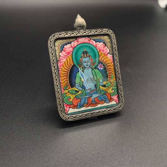 A 3.5x4.5cm hand-painted Tibet Red Cloud Akasagarbha (虚空藏菩萨) Thangka pendant with 925 silver featuring the wealth deity of the Buddhist realm, representing wealth and fortune in Buddhist tradition.