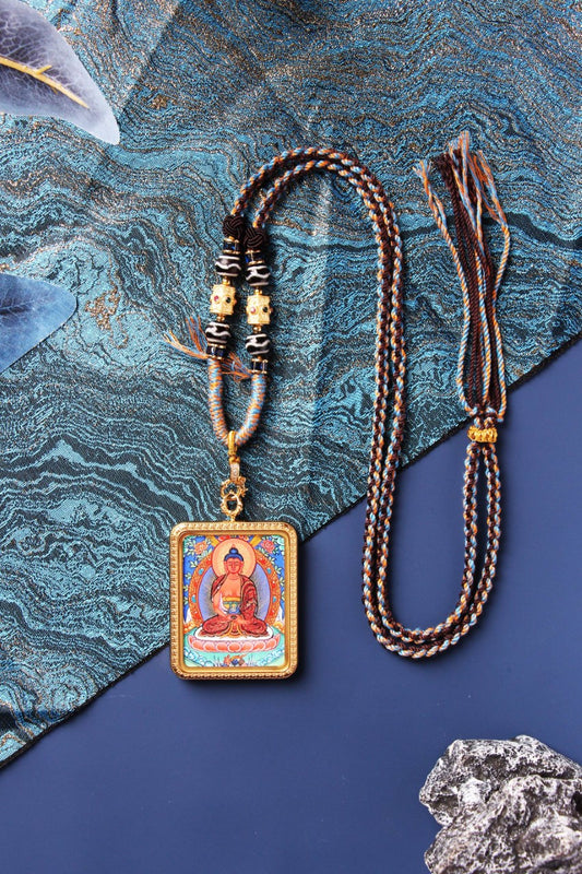 A 3.5x4.5cm hand-painted Tibetan Buddhist Amitabha Buddha Thangka pendant featuring the Buddha of Infinite Light and Life, encased in exclusive 925 Sterling Silver, representing the compassionate guide to the Western Pure Land in Tibetan Buddhist culture.