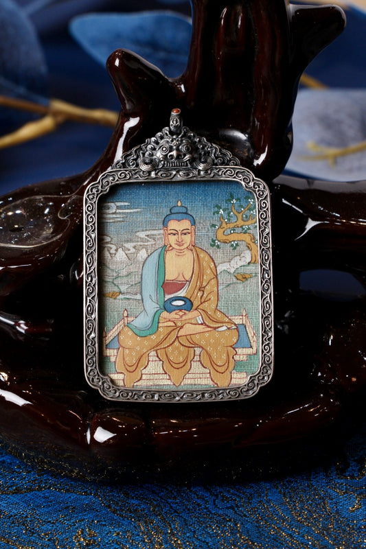 Thangka necklace portraying Amitabha Buddha, an embodiment of compassion and the Pure Land path in Tibetan Buddhist tradition.