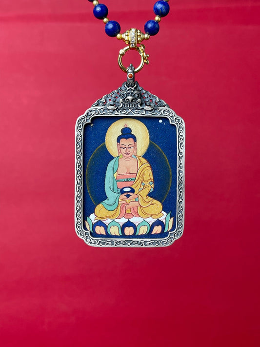 Detailed view of the refined silver casing for the Amitabha Thangka pendant, symbolising liberation and tradition in Buddhist practice.