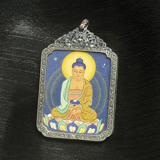 The Tibet Coarse Amitabha Thangka pendant displayed as a sacred amulet for peace and purity, embodying Tibetan Buddhist tradition
