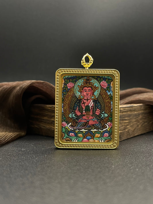 Detailed view of the titanium casing for the Amitayus Thangka pendant, symbolising longevity and tradition in Buddhist practice.