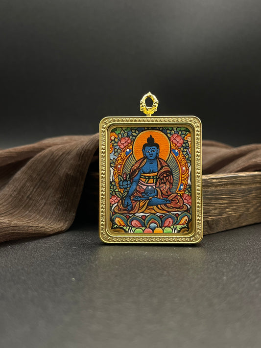 Detailed view of the titanium casing for the Bhaisajyaguru Thangka pendant, symbolising healing and tradition in Buddhist practice.