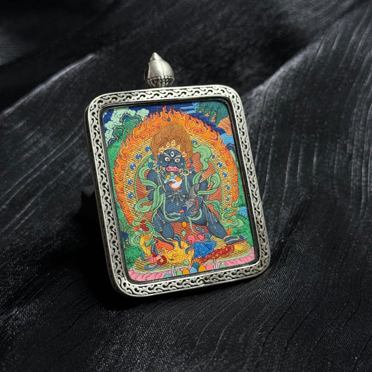 A 4x5cm hand-painted Tibet Mensar Black Jambhala Thangka pendant, representing wealth and protection from petty persons.