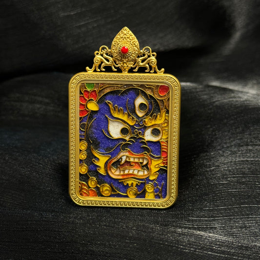 Detailed view of the copper 24K gold-plated casing for the Black Jambhala cloisonné Thangka pendant.