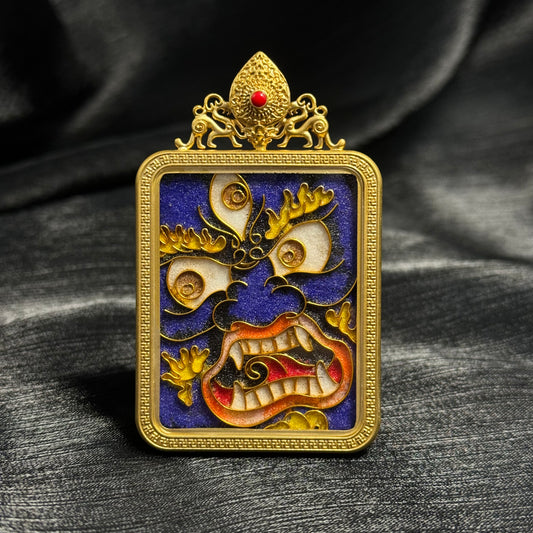 Detailed view of the copper 24K gold-plated casing for the Mahakala cloisonné Thangka pendant.