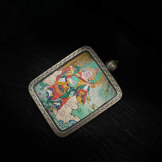 A 3.5x4.5cm hand-painted Rekong Cuiying series Dhritarashtra (Eastern Guardian King) Thangka pendant featuring upholding the realm and protection in Buddhist tradition.