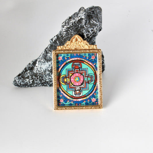 Detailed view of the titanium steel casing for the Dual Jambhala and Vasudhara Thangka pendant, symbolizing protection and elegance in Tibetan Buddhist tradition.