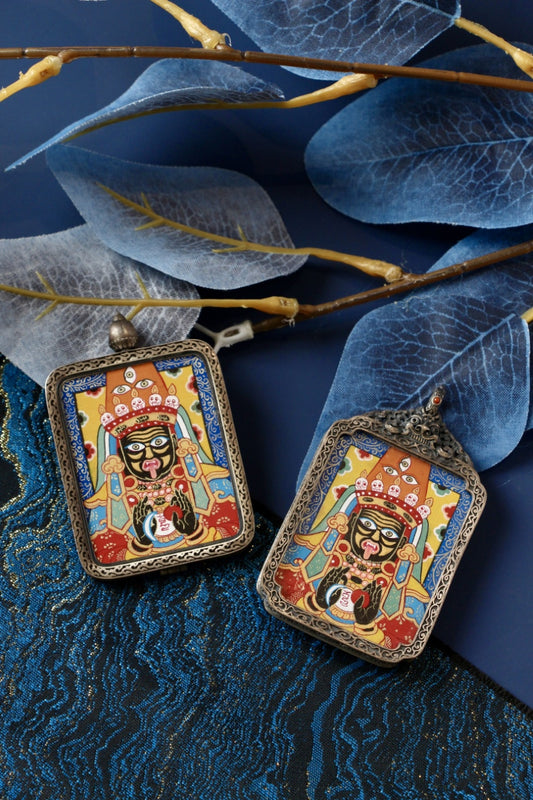 Tibetan Buddhist thangka pendant depicting Zaki Lhamo, the revered wealth protector deity, symbolizing prosperity, protection, and abundance.