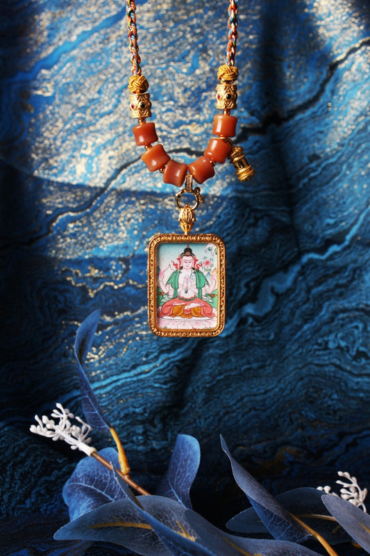 The Nepal Premium Green Tara Thangka pendant displayed as a sacred amulet for compassion and swift success, embodying Tibetan Buddhist tradition.
