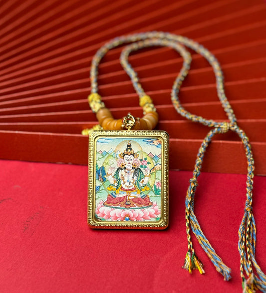 Close-up detail of the Nepal Four-Armed Avalokiteshvara Thangka showing hand-painted mineral pigments, showcasing the masterful artistry.
