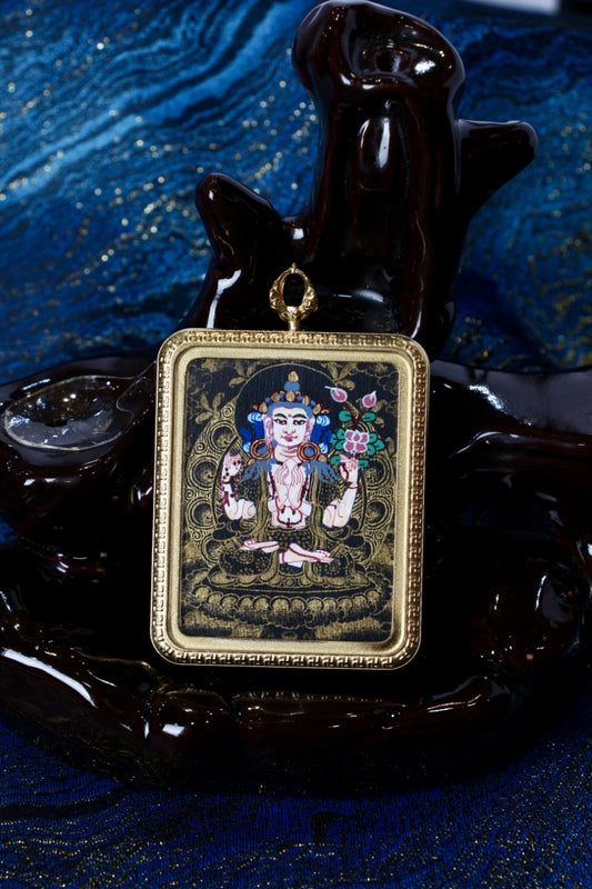 Tibetan thangka jewelry featuring Chenrezig, inspired by traditional Tibetan Buddhist sacred art.