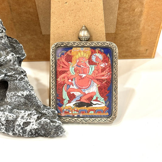 Close-up detail of the Tibet Qigang Ganesh Thangka painting showing intricate natural mineral pigment work, showcasing the masterful artistry of Tibetan lineage painters.