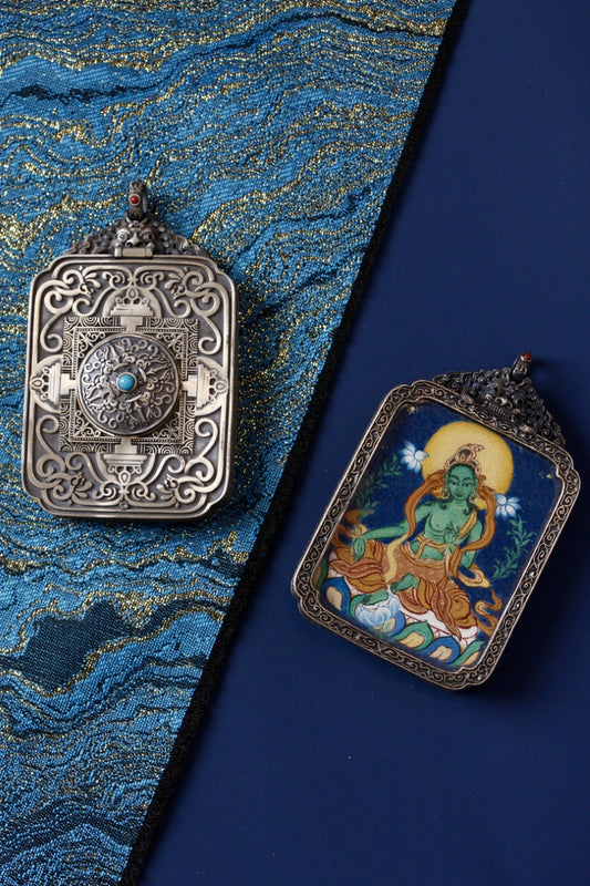 Green Tara thangka pendant depicting the Tibetan Buddhist goddess of compassion, protection, and swift assistance.