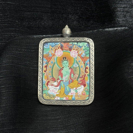 Close-up detail of the Menri Green Tara Thangka painting showing intricate natural mineral pigment work and symbolic gestures, showcasing the artistry of Tibetan lineage painters.