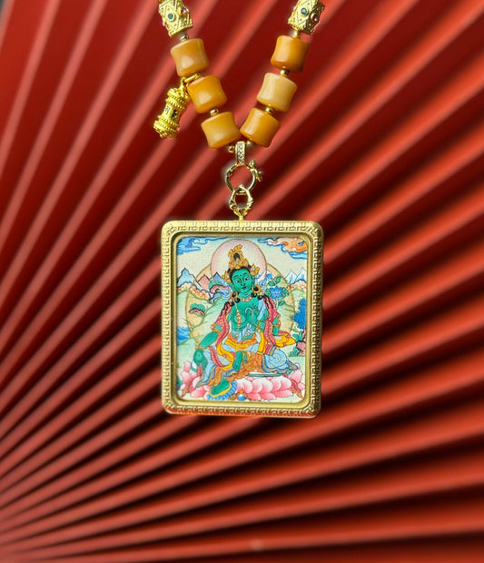 Detailed view of the titanium casing for the Green Tara Thangka pendant, symbolising compassion and tradition in Buddhist practice.