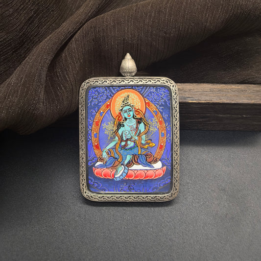 Close-up detail of the Rekong Blue Thangka Green Tara painting showing natural mineral pigments, showcasing the masterful artistry of Rekong lama painters.
