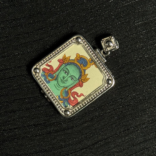 Close-up detail of the Tibet Green Tara Thangka painting showing natural mineral pigments, showcasing the masterful artistry of Tibetan lineage painters.