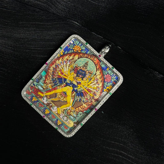 Close-up detail of the Rekong Cuiying Kalachakra Thangka painting showing natural mineral pigments.