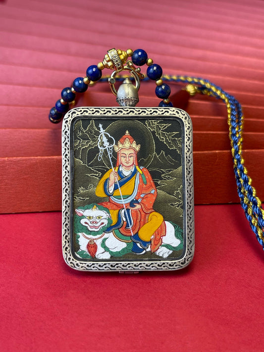 Hand-painted Rekong Ksitigarbha (地藏王菩萨) Thangka pendant 3.5x4.5cm with 925 silver casing and lapis cord featuring the Great Vow Bodhisattva, representing liberate beings and fulfil wishes in Buddhist tradition.