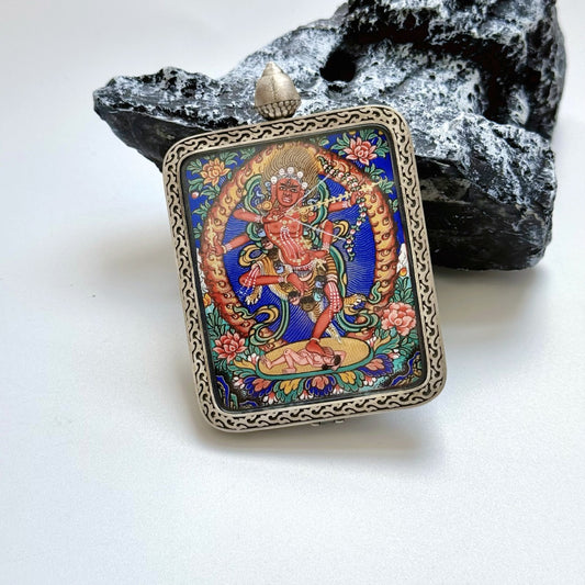 Close-up detail of the Rebgong Kurukulla Thangka painting showing intricate natural mineral pigment work, showcasing the masterful artistry of Rebgong lineage painters.