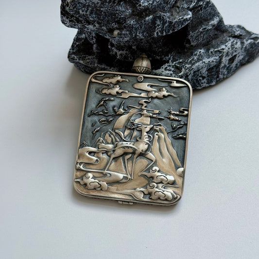 The Rebgong Kurukulla Thangka pendant displayed as a sacred amulet for love and worldly blessings, embodying Tibetan Buddhist tradition.